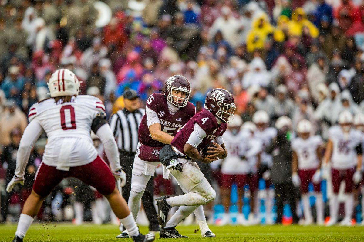 Freshaman QB Connor Weigman (15) passes the ball to sophomore DB Amari Daniels (4) during a game against UMass on Saturday, Nov. 19 at Kyle Field (Ishika Samant/The Battalion)