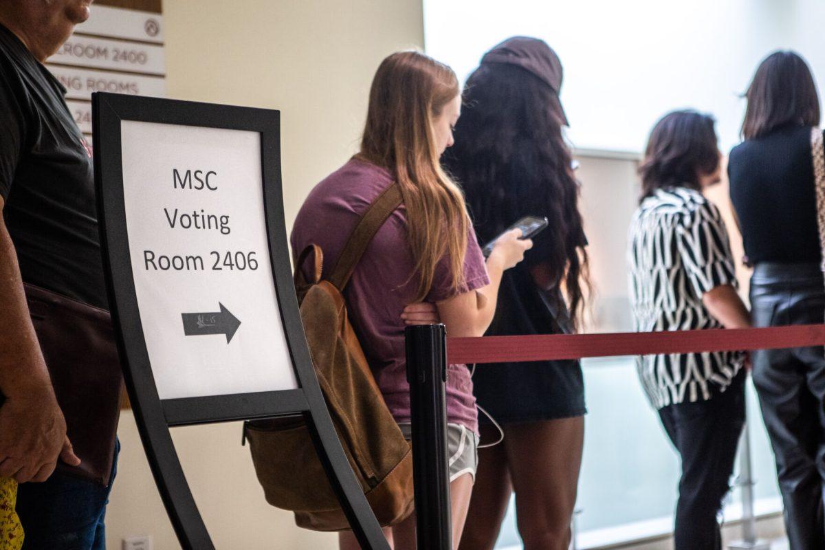 People wait in line outside Room 2406 to vote at the MSC on Election Day, Nov. 8, 2022.