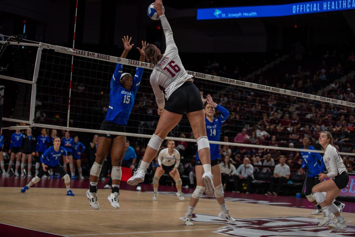 Graduate OH Caroline Meuth (16) spikes the ball during A&amp;M's match against Kentucky at Reed Arena on Sunday, Oct. 23, 2022.