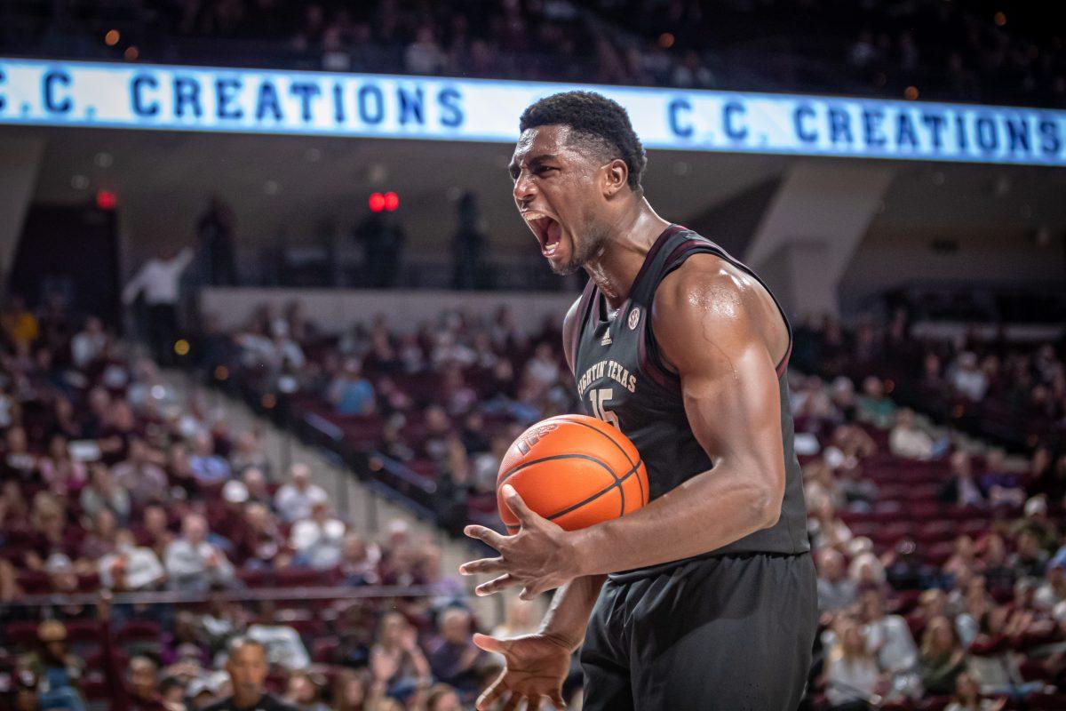 Junior F Henry Coleman III (15) celebrates after dunking on the ACU basket during Texas A&Ms game against ACU at Reed Arena on Friday, Nov. 11, 2022.