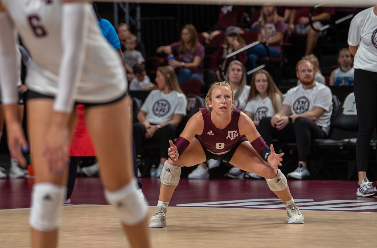 Junior L/DS Lauren Hogan (8) gets in stance before a serve during A&amp;M's match against Alabama at Reed Arena on Wednesday, Nov. 2, 2022.