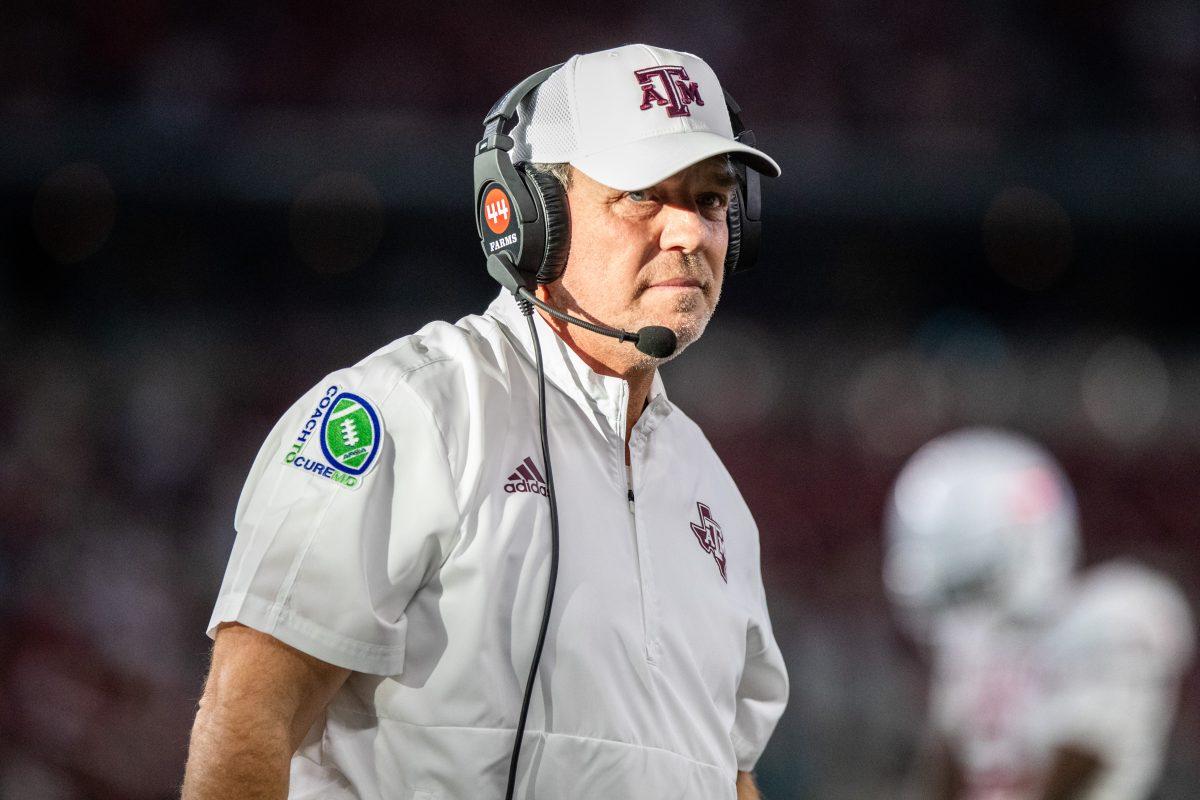 Texas A&M Jimbo Fisher coordinates from the sidelines at the Southwest Classic game against Arkansas at AT&T Stadium on Sept. 24, 2022. (Cameron Johnson/The Battalion)