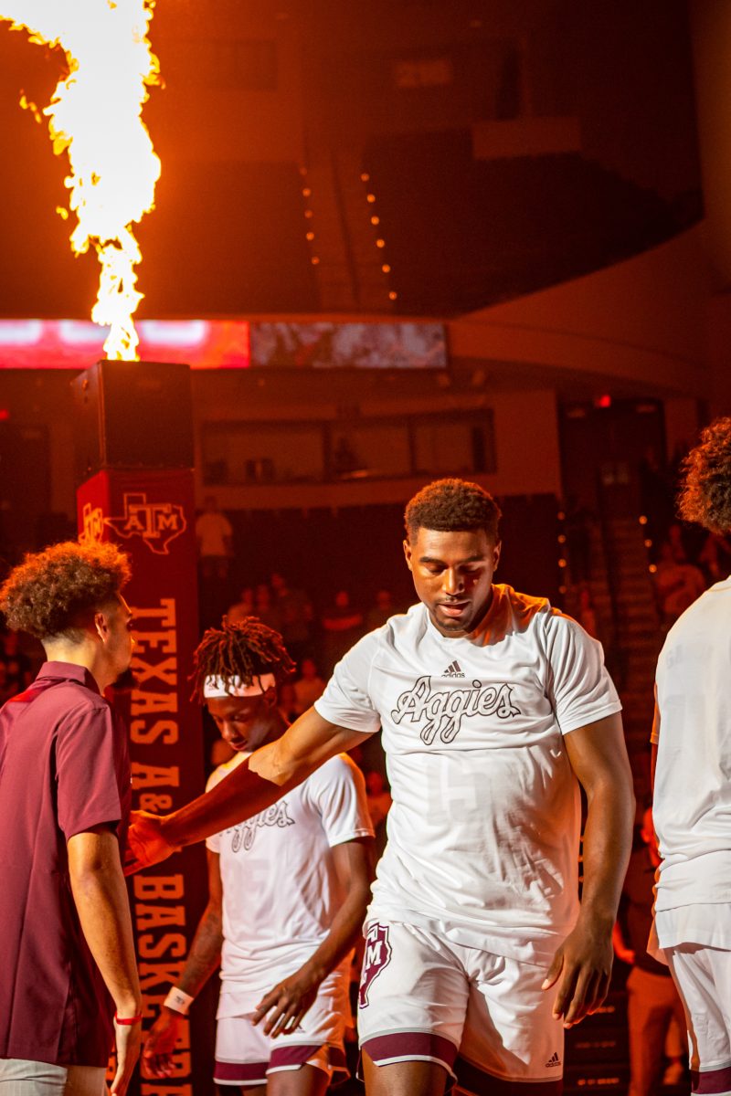 Junior F Henry Coleman III (15) walks out as the starting lineup is announced before the start of Texas A&Ms game against ULM at Reed Arena on Monday, Nov. 7, 2022.