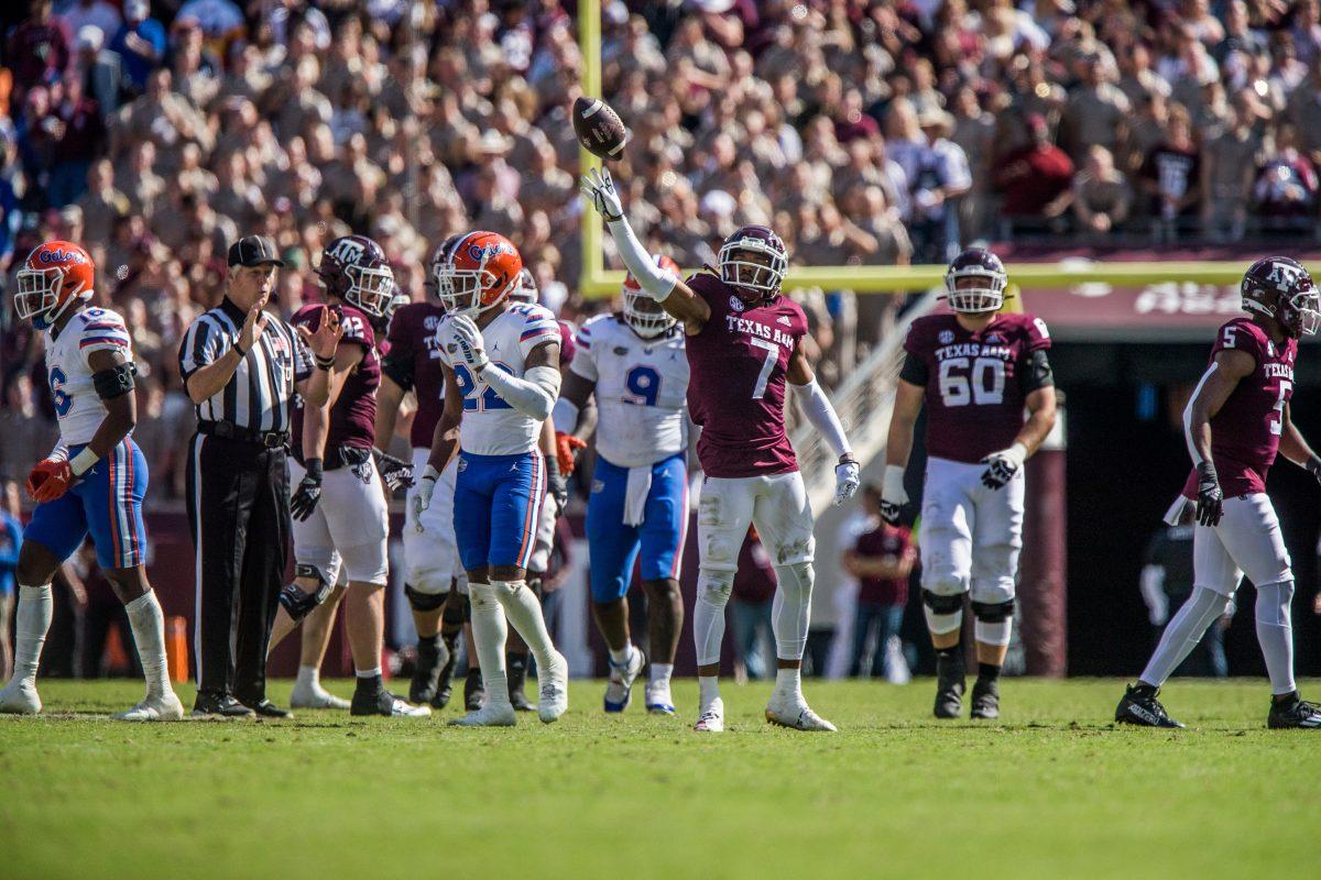 <p>Sophomore DL Tyrek Chapell (7) passes the ball to the refs during a game against Florida on Saturday, Nov. 5, 2022 at Kyle Field</p>