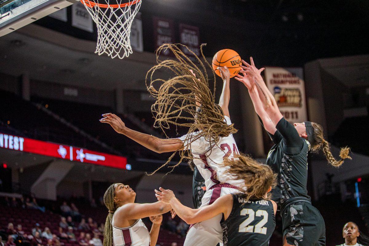 Junior G Sahara Jones (24) catches a rebound during a game versus Army at Reed Arena Tuesday, Nov. 13, 2022.