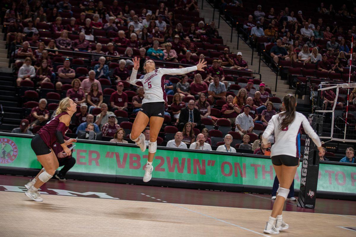 Freshman OH Lexi Guinn (5) hits the ball during A&Ms match against Kentucky at Reed Arena on Sunday, Oct. 23, 2022.