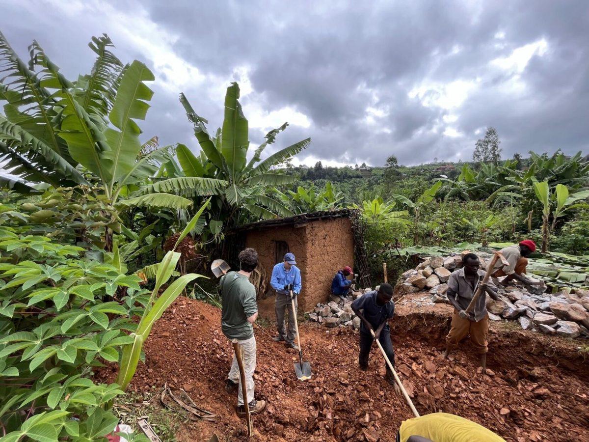 Members of Engineers Without Borders at Texas A&M help build a latrine in a Rwanda community in summer 2022.