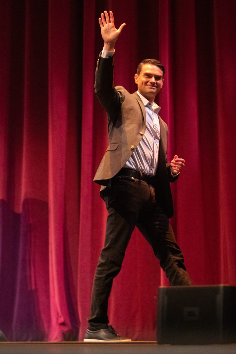 Political commentator Ben Shapiro walks across stage in Rudder Auditorium on Tuesday, Nov. 1, 2022. (Jonathan Taffet / The Battalion)