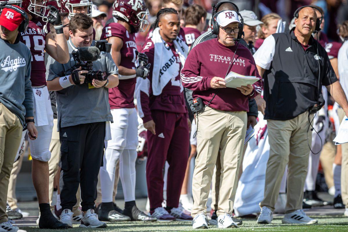 Texas A&M coach Jimbo Fisher calls plays from the sideline during Texas A&Ms game against Florida at Kyle Field on Saturday, Nov. 5, 2022.