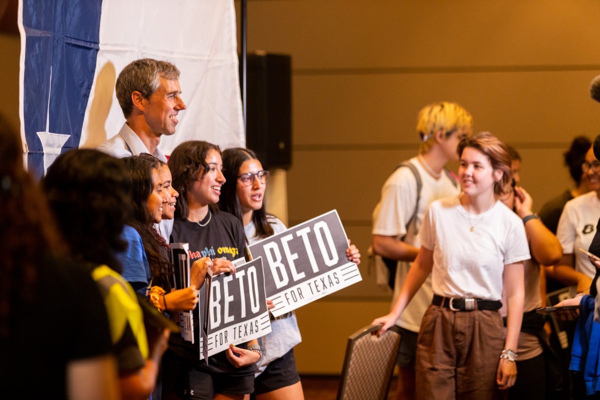 Supporters pose for a photograph with O'Rourke in the Bethancourt Ballroom at the MSC on Monday, Nov. 7, 2022. (Samuel Falade/The Battalion)