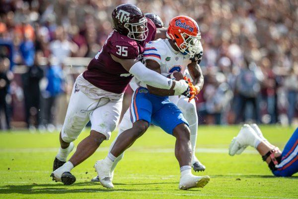 Junior DL McKinnley Jackson (35) tackles Florida RB Montrell Johnson Jr. (2) during Texas A&M's game against Florida at Kyle Field on Saturday, Nov. 5, 2022.