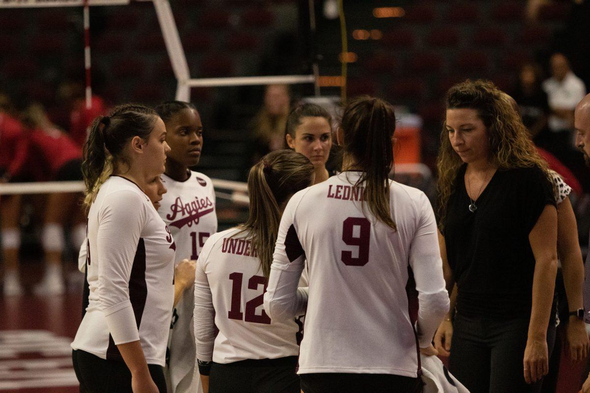 Aggies talk to head coach Laura Bird Kuhn during game at Reed Arena on Friday, Sep. 9, 2022.