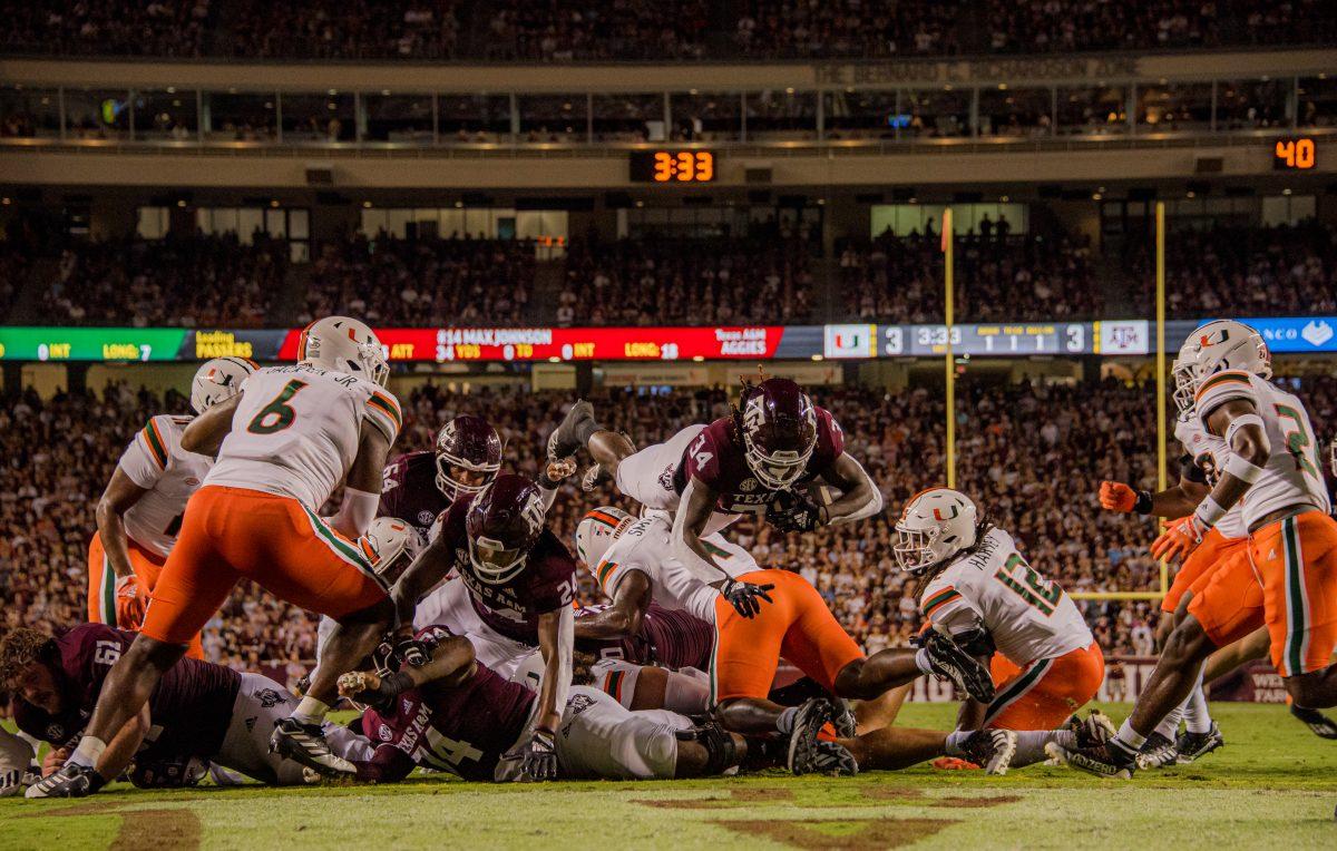 Freshman RB LJ Johnson Jr. (34) rushes for one yard to score the first touchdown of Texas A&amp;M's game against Miami at Kyle Field on Saturday, Sept. 17, 2022.