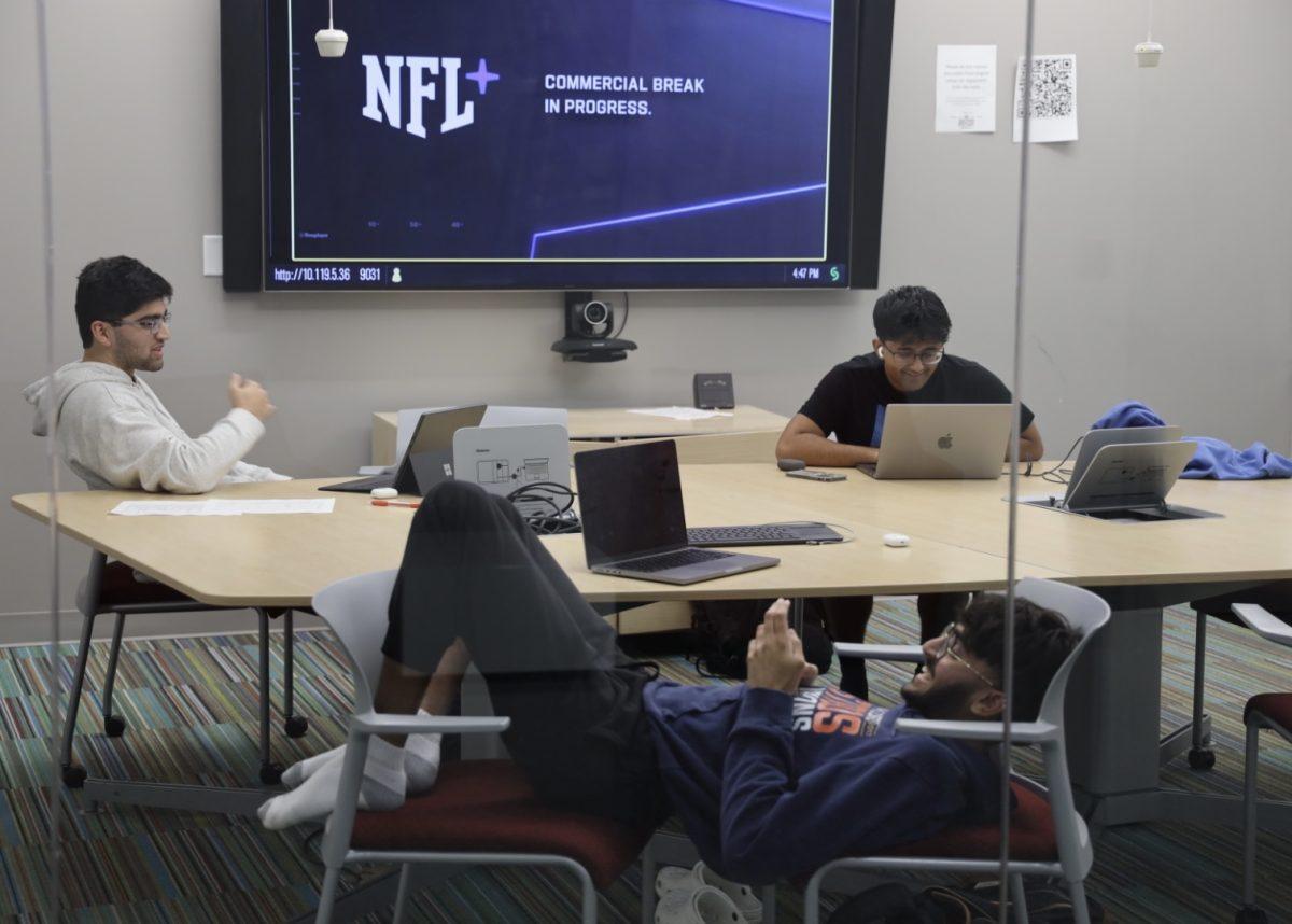 Students sit on their computer during syllabus week in Evans Library.&#160;