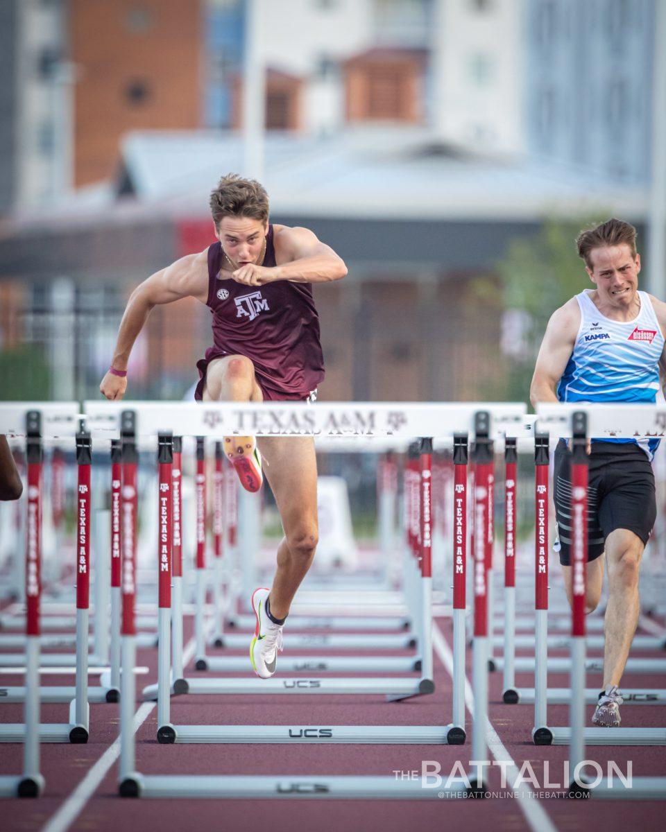 Sophomore Connor Schulman clears a hurdle during the mens 110m hurdles at the Alumni Muster meet on Saturday, April 30, 2022.
