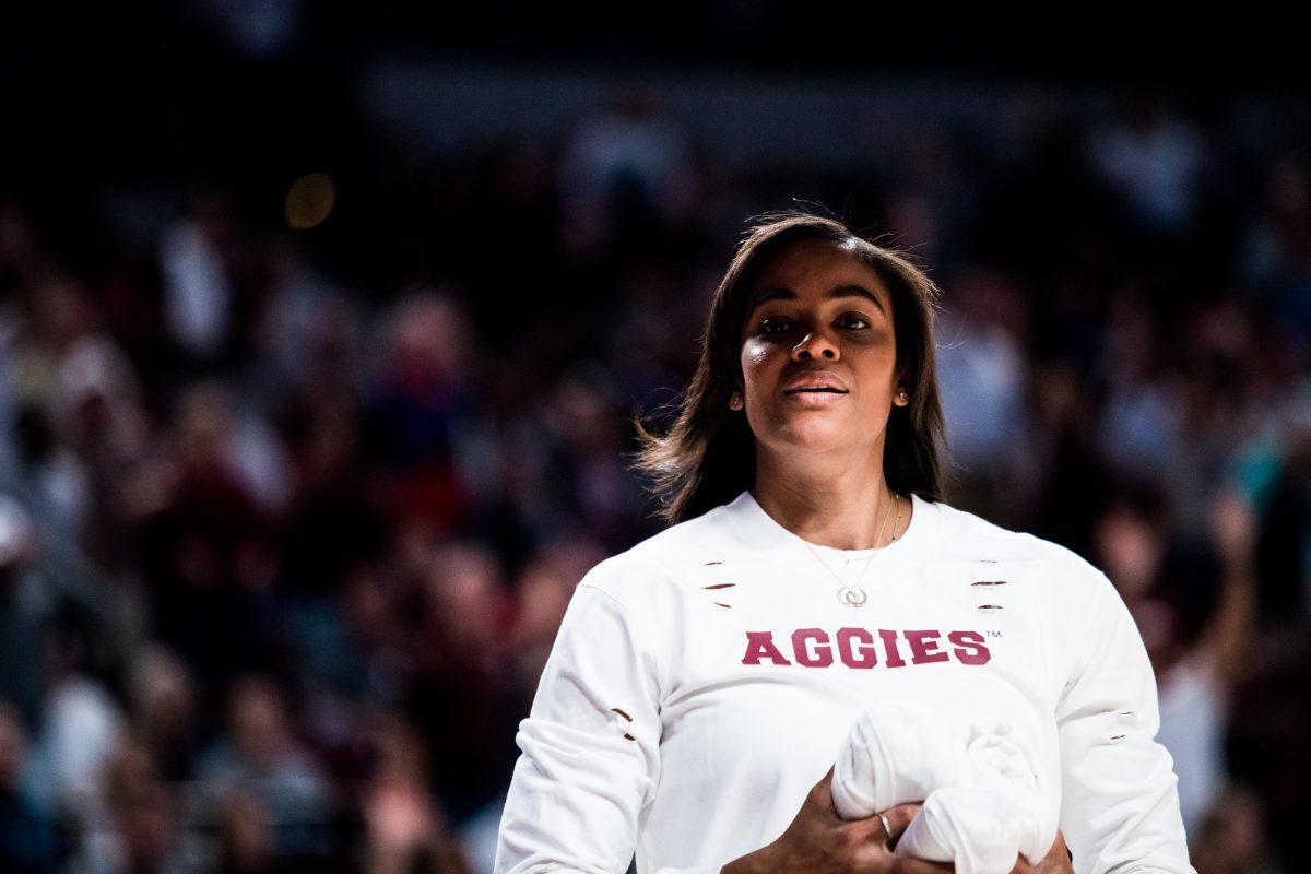 <p>Women's Basketball head coach Joni Taylor throws shirts to the student during a game against A&M Kingsville at Reed Arena on Friday, Nov. 4, 2022.</p>