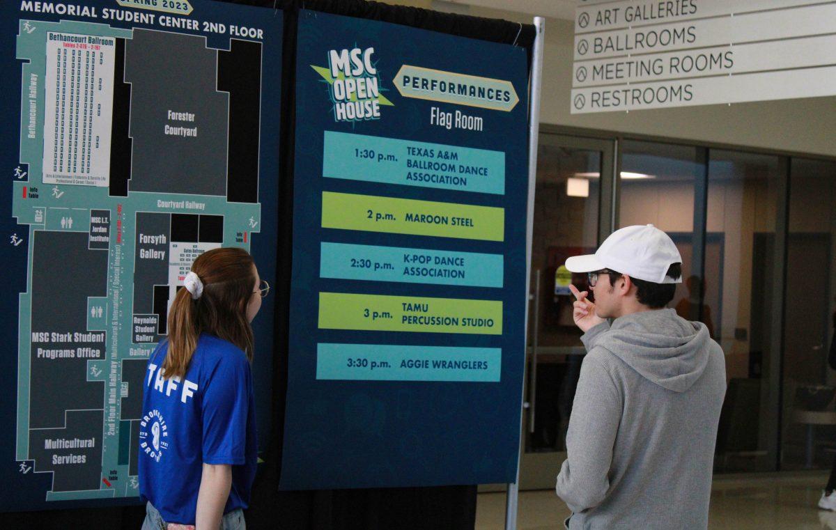 Students look at a poster showing the locations of student organization tables at the main MSC Open House booth on Sunday, Jan. 22, 2023 at the Memorial Student Center.