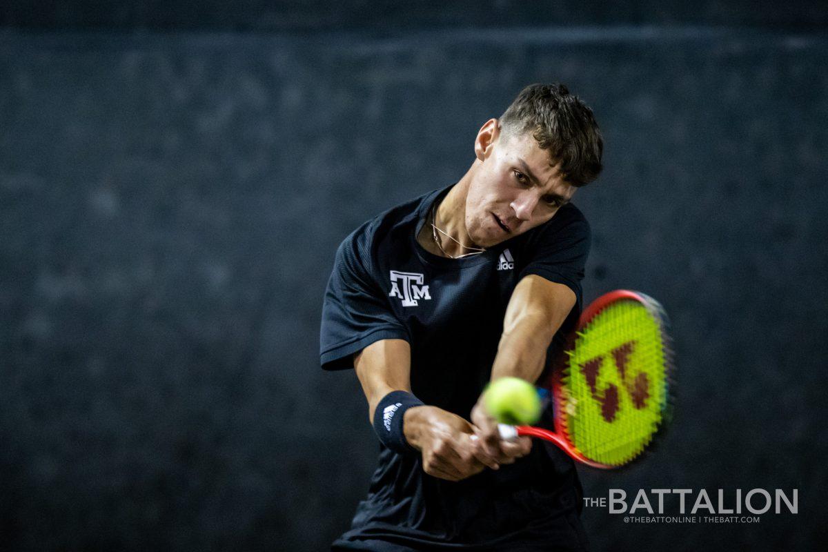 Freshman Giulio Perego during his match against Chih Chi Huang from the University of Texas at the Mitchell Tennis Center on Wednesday, Mar. 9, 2022.