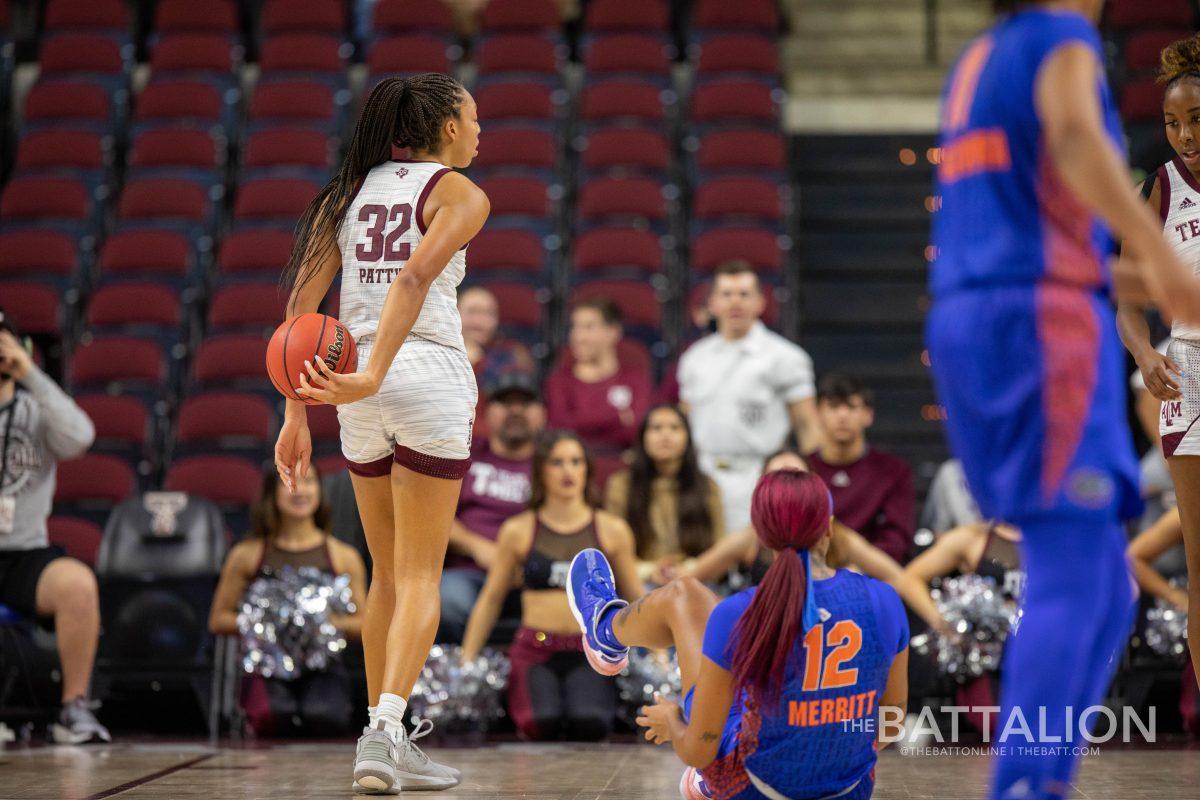 Forward Jordyn Merritt (12) attempted to steal the ball from senior forward Aaliyah Patty (32) but was fouled before falling in the Aggies' game against the Gators in Reed Arena on Sunday, Jan. 9, 2022.