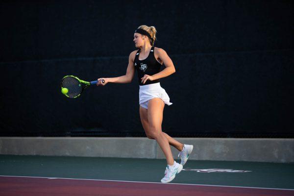 Freshman <span id="docs-internal-guid-60801455-7fff-c4b9-e198-e0428d426d33"><span>Lizanne Boyer</span></span> being able to make contact with the tennis ball with a forehand move while in mid-air at Mitchell Outdoor Tennis Center on Tuesday, Jan. 17, 2023.