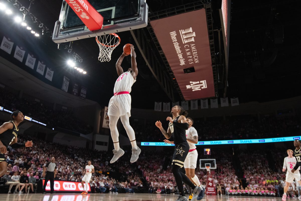 Junior F Henry Coleman III (15) dunks the ball during Texas A&Ms game against Vanderbilt at Reed Arena on Saturday, Jan. 28, 2023.