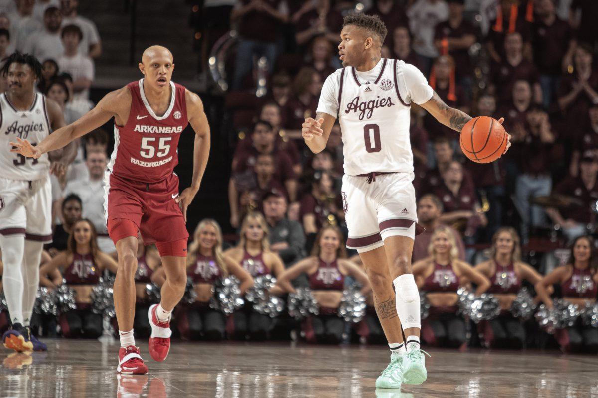 Graduate G Dexter Dennis (0) creates space against Freshman G Jordan Walsh (55) at Reed Arena on Wednesday, Feb. 15, 2023