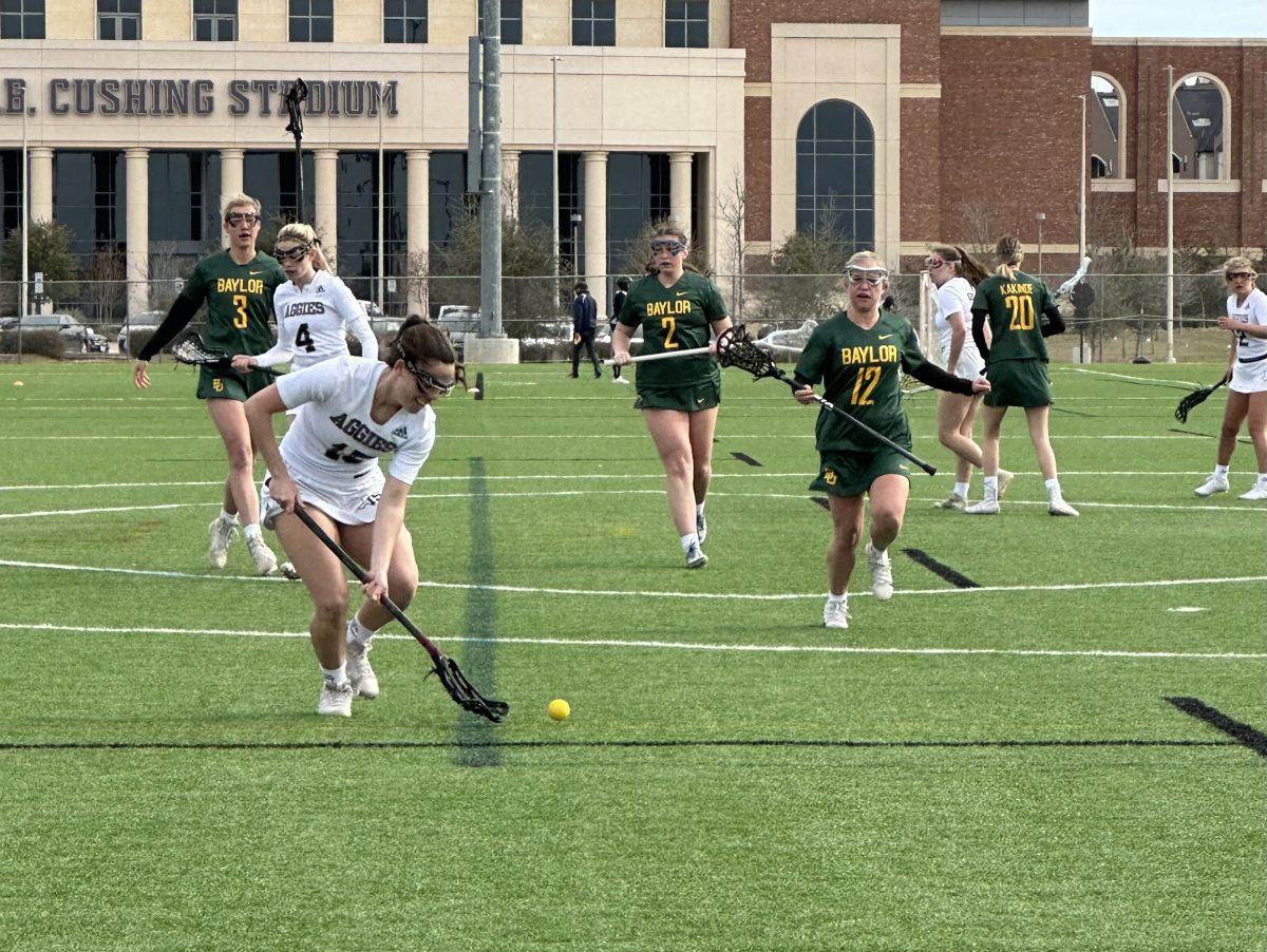 No. 15 Elizabeth Ohnesorge takes possession just outside the crease against Baylor during the A&M Women’s Lacrosse double-header on Feb. 18. 