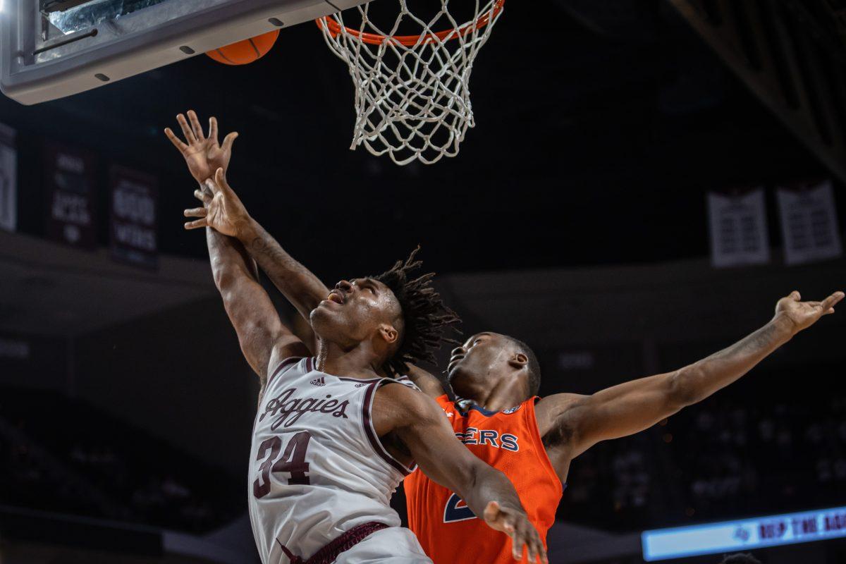 Junior F Julius Marble (34) jumps to shoot a layup during Texas A&amp;M's game against Auburn at Reed Arena on Tuesday, Feb. 7, 2022.