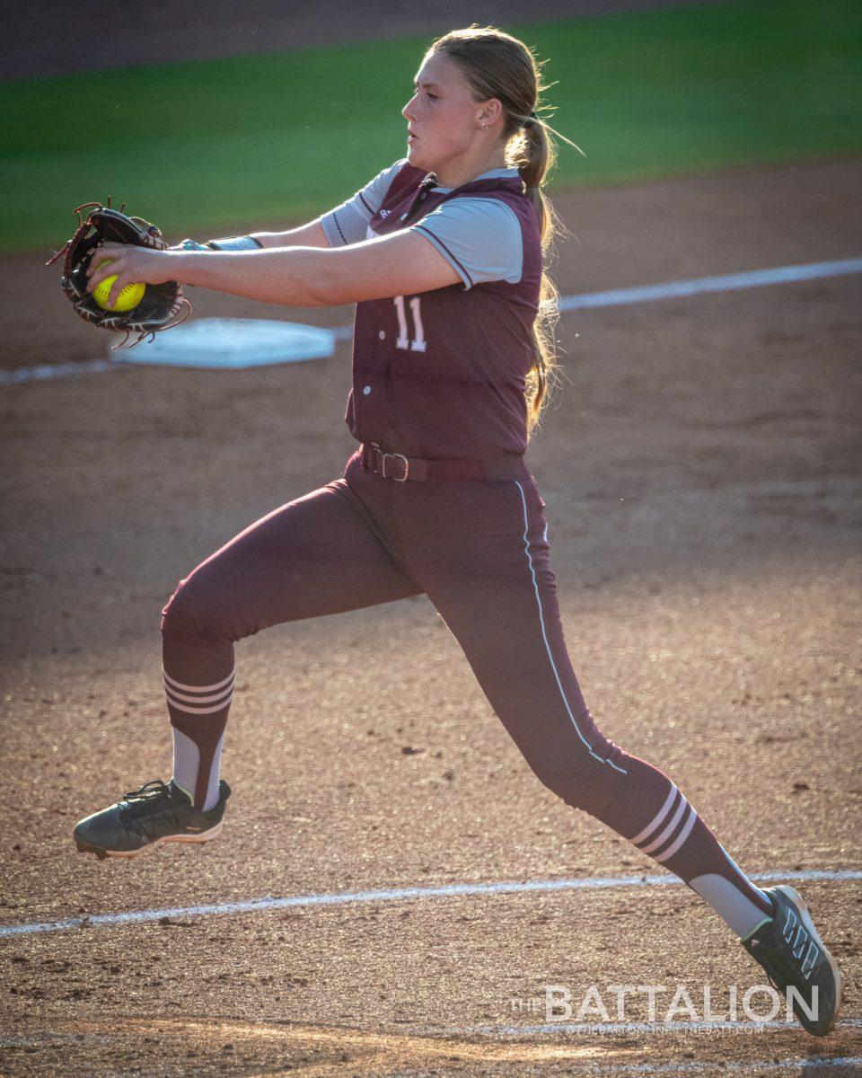 Freshman P/1B Emiley Kennedy (11) pitches during the top of the third inning in Davis Diamond on Wednesday, April 27, 2022.
