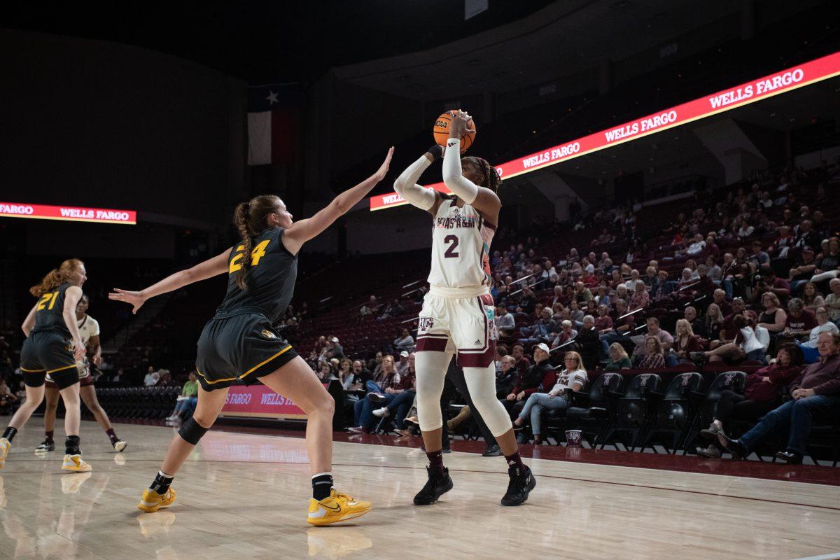 Freshman F Janiah Barker (2) shots the basketball in front of Freshman G Ashton Judd (24) to add points on the scoreboard at Reed Arena on Monday, Feb. 20, 2023.