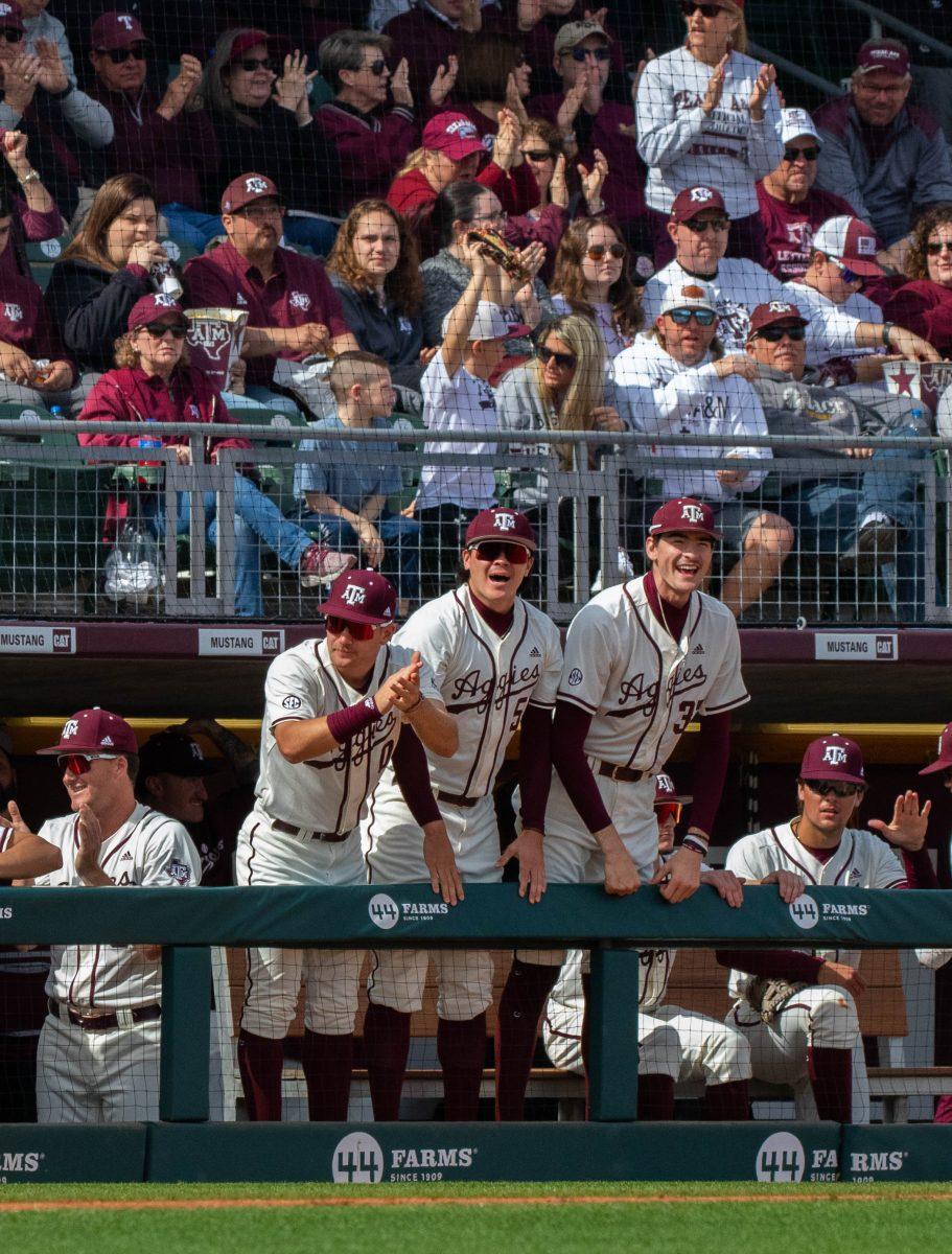The Aggie Baseball Team cheering their teammates on from the dugout during the game vs. Seattle U at Blue Bell Park on Sunday, Feb. 19, 2023.