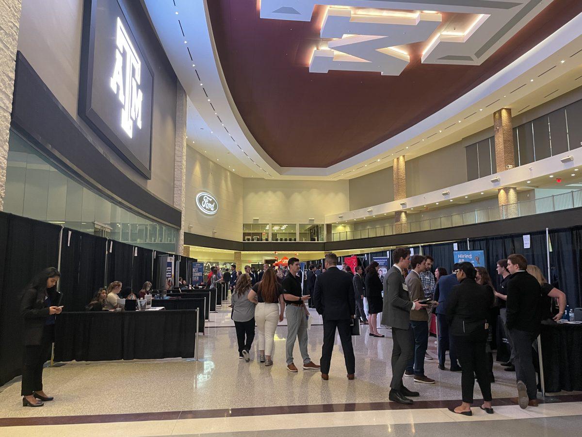 Students walk around the business fair in Ford Hall on Thursday, Feb. 9, 2023.&#160;