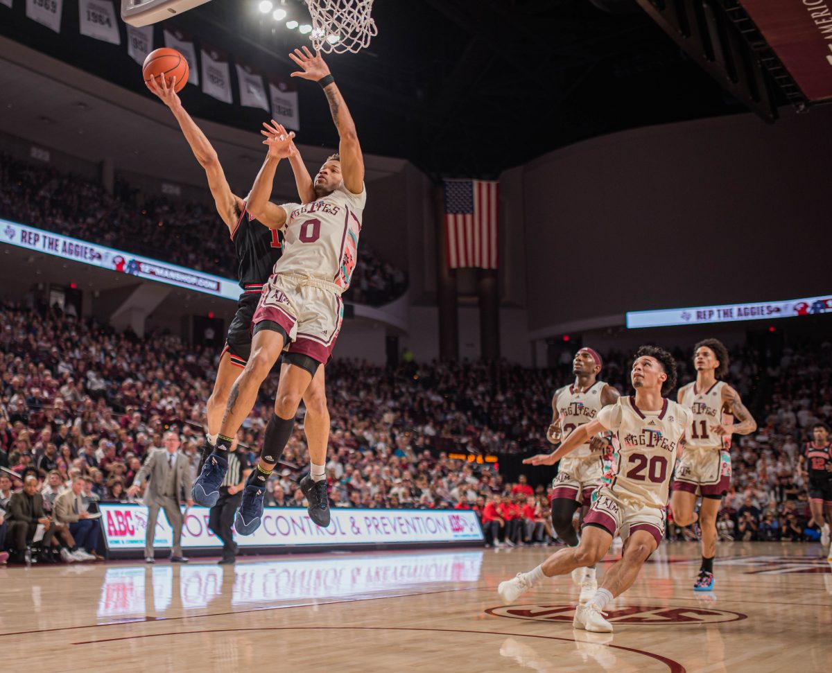 Graduate G Dexter Dennis (0) blocks Georgia G Jabri Abdur-Rahim (1) from shooting a layup during a game vs. Georgia at Reed Arena on Saturday, Feb. 5, 2023.