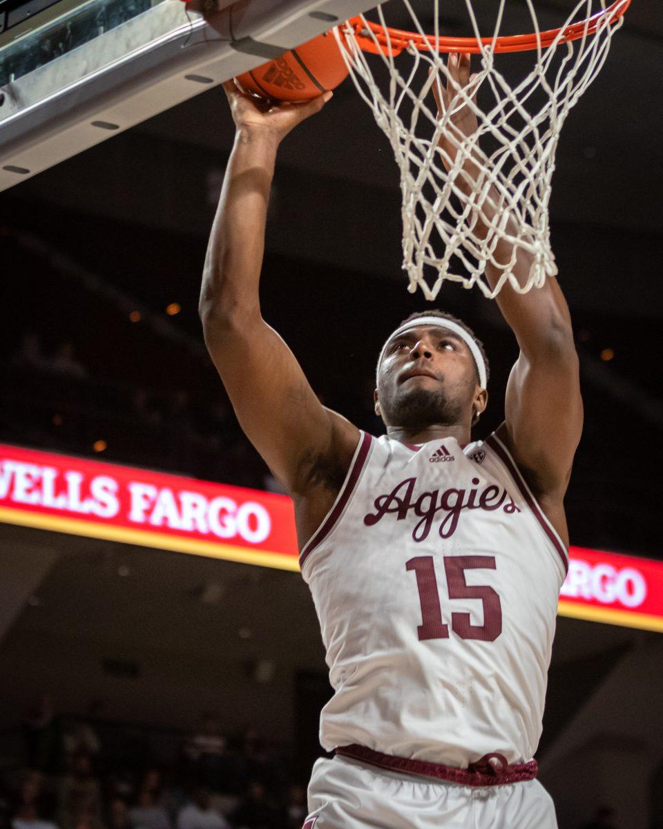 Junior F Henry Coleman III (15) jumps to shoot a layup during Texas A&Ms game against SMU at Reed Arena on Wednesday, Nov. 30, 2022.
