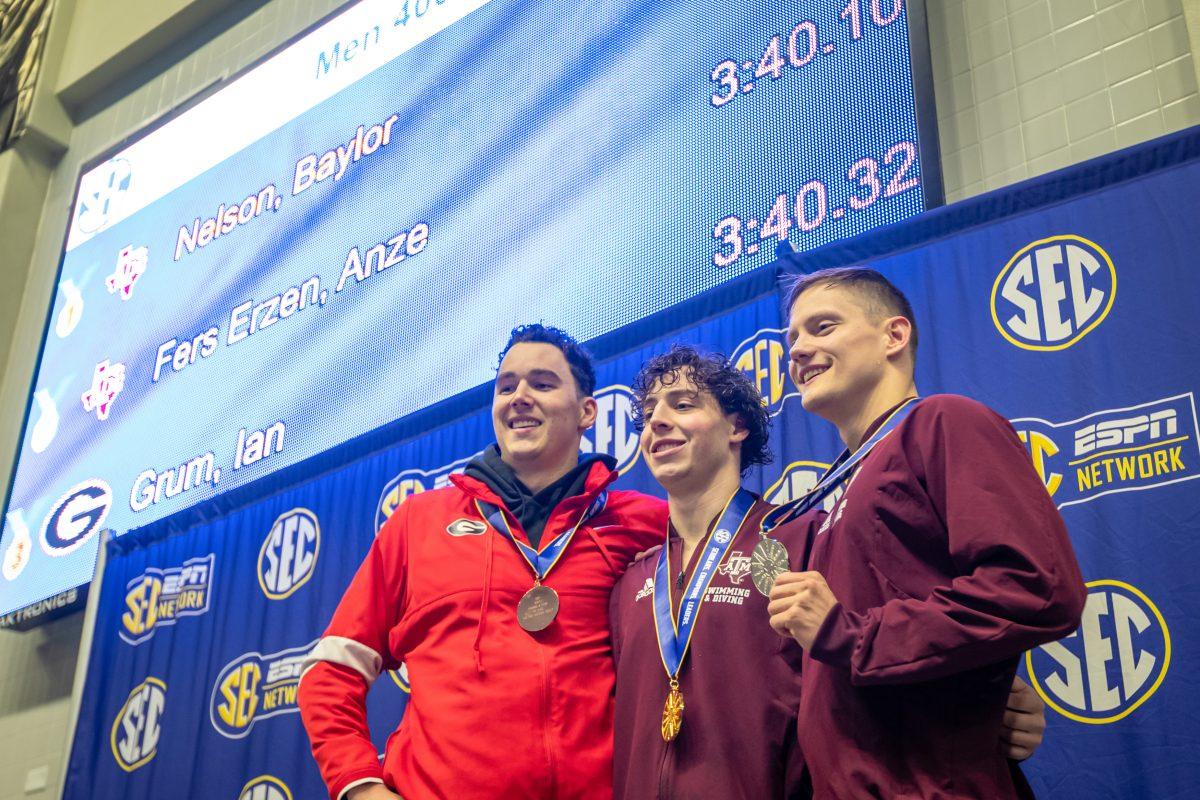 Sophomores Baylor Nelson and Anze Fers Erzen stand on top of the podium after going 1-2 in the championsip final of the Mens 400 Yard IM during the 2023 SEC Swimming & Diving Championships at the Rec Center Natatorium on Wednesday, Feb. 16, 2022.