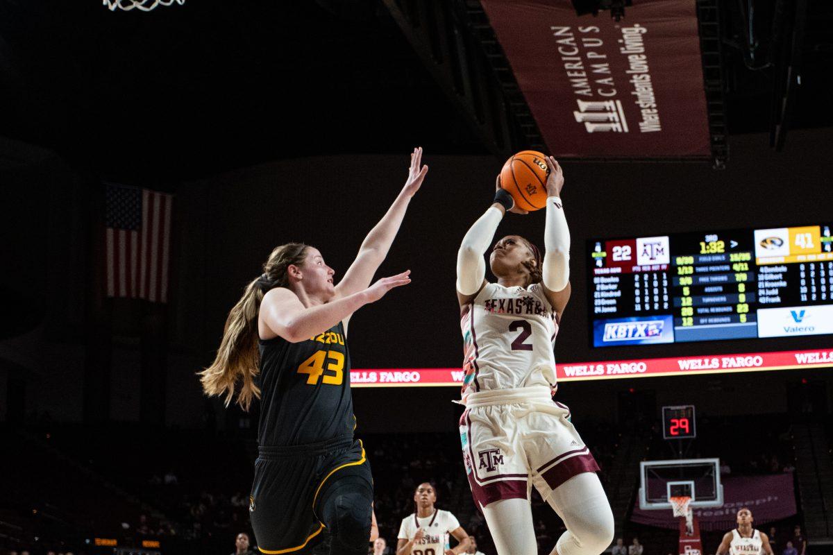 Freshman F Janiah Barker (2) attempts to score a two pointer in front of Senior F Hayley Frank (43) at Reed Arena on Monday, Feb. 20, 2023.
