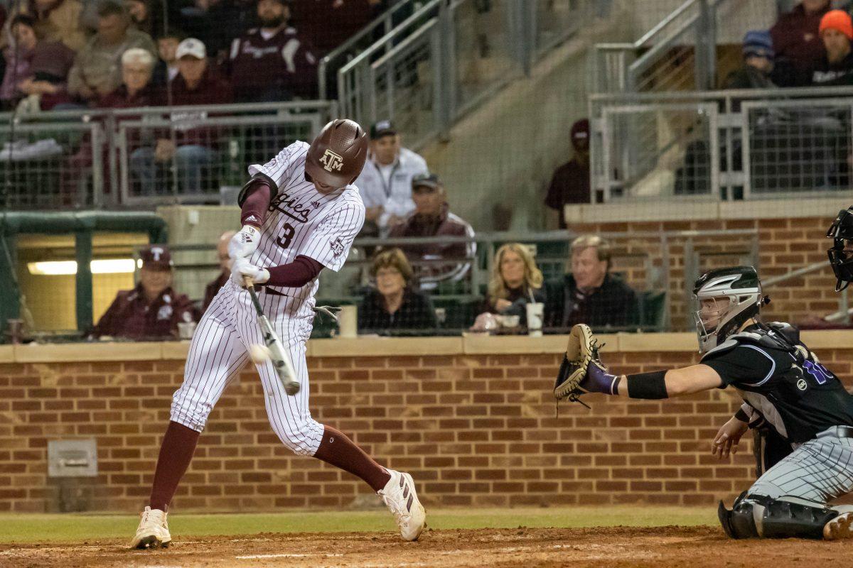 Freshman INF Kaeden Kent (3) swings to hit the ball during Texas A&Ms game against Portland at Olsen Field on Friday, Feb. 24, 2023.
