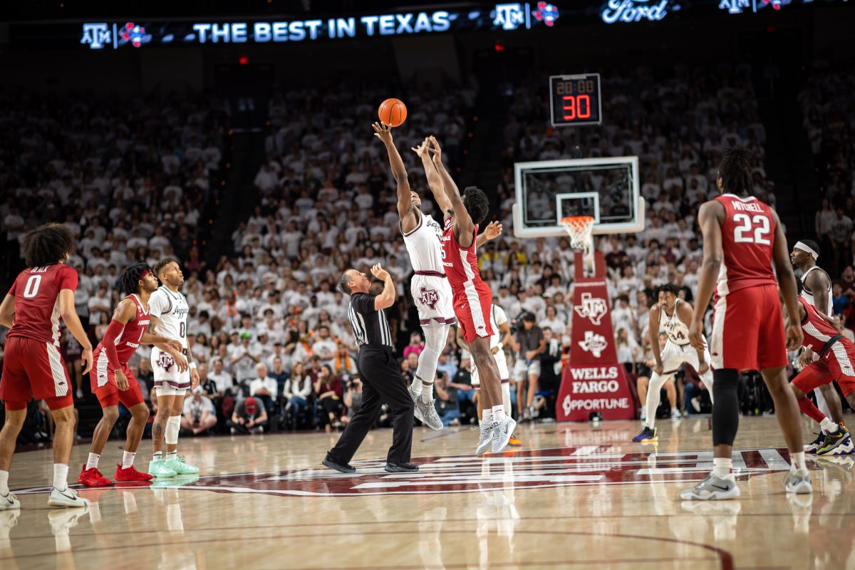 Junior F Henry Coleman III (15) jumps for the ball at tipoff during Texas A&Ms game against Arkansas at Reed Arena on Wednesday, Feb. 15, 2022.