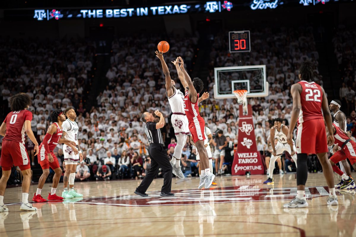 Junior F Henry Coleman III (15) jumps for the ball at tipoff during Texas A&amp;M's game against Arkansas at Reed Arena on Wednesday, Feb. 15, 2022.