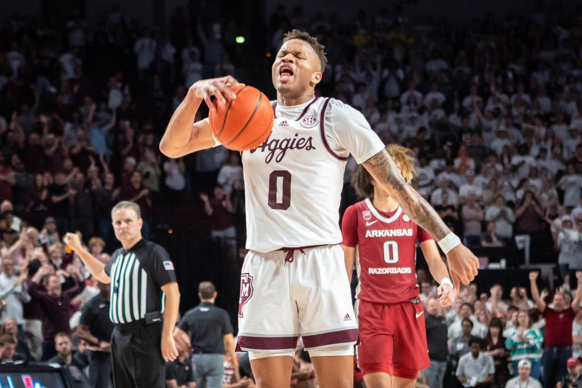 Graduate G Dexter Dennis (0) reacts after the Aggies retain possession of the ball in the final seconds of Texas A&Ms game against Arkansas at Reed Arena on Wednesday, Feb. 15, 2022.