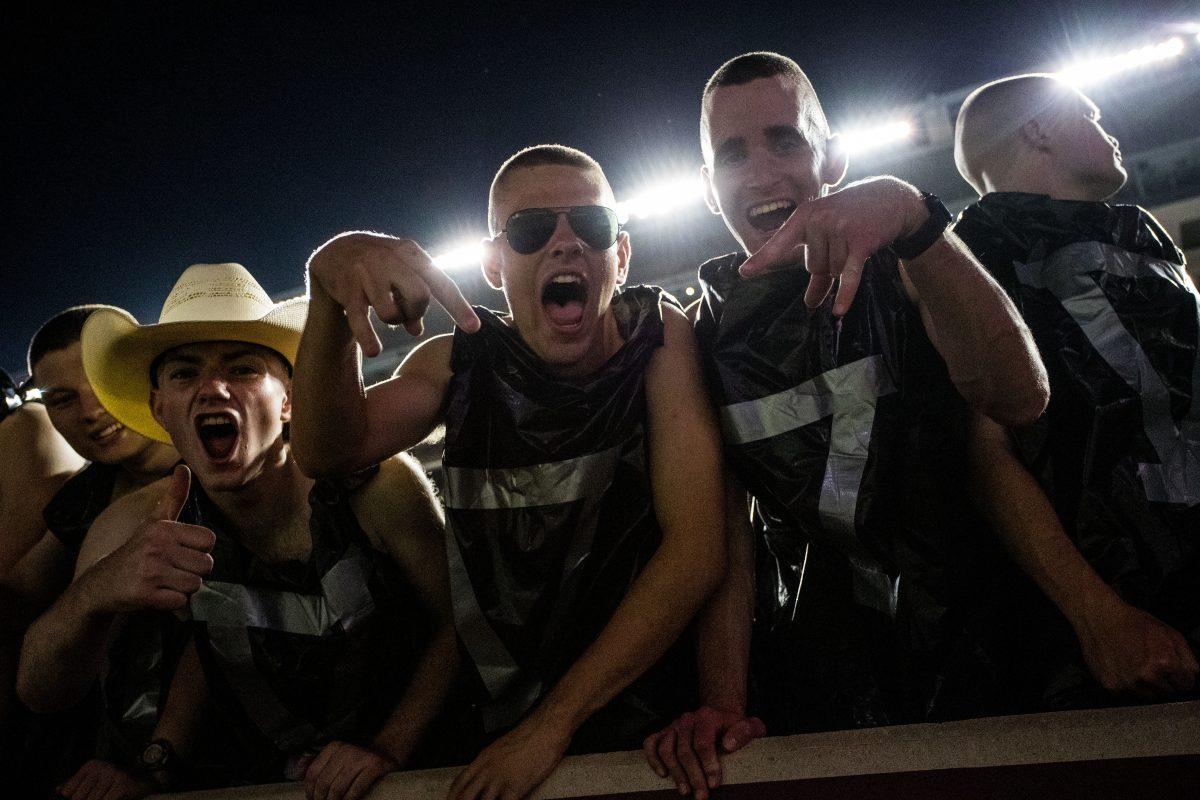 Crowd members with "horns down" gestures at Kyle Field Friday, Sept. 16, 2022.