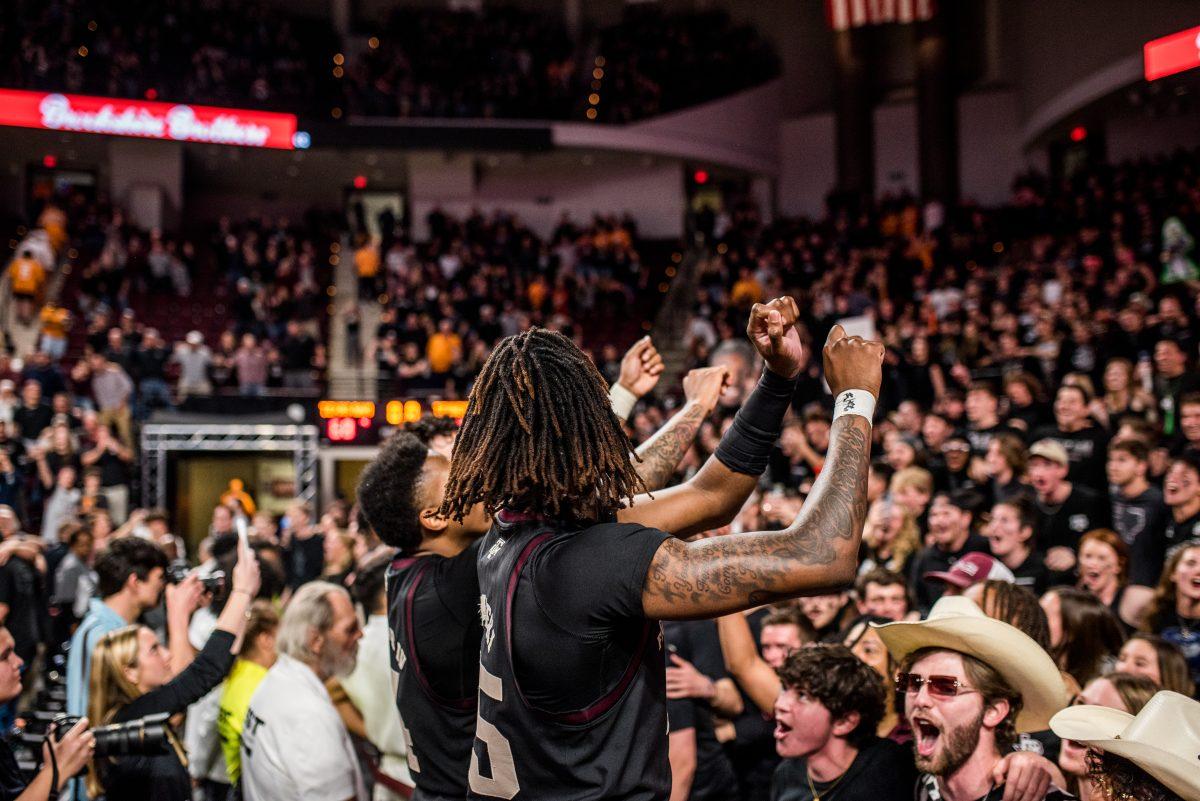 Sophomore G Manny Obaseki (35) during the Aggie War Hymn after a game vs. Tennessee at Reed Arena on Tuesday, Feb. 21, 2023.