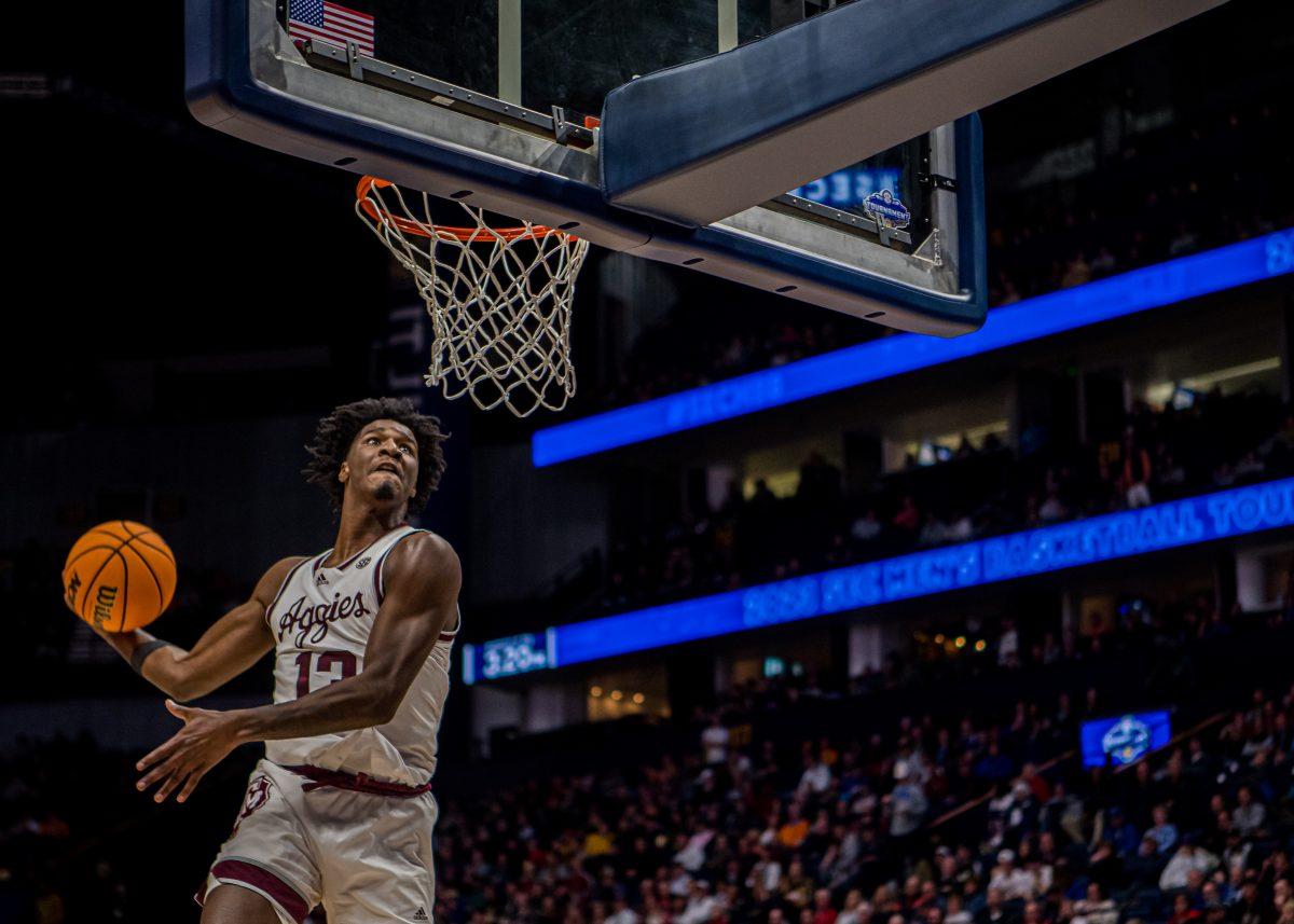 Freshman F Solomon Washington (13) dunks the ball during a game vs. Vanderbilt on Saturday, March 11, 2023 in Bridgestone Arena, Nashville, Tennessee.