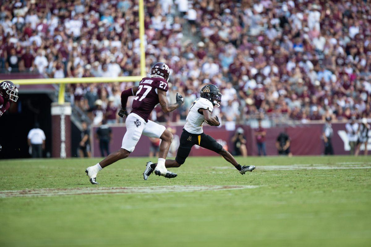 App States Dashaun Davis (17) avoids junior DB Antonio Johnson (27) at Kyle Field on Saturday, Sep. 10, 2022.