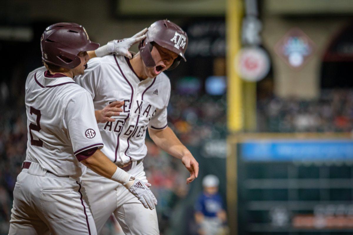 Junior DH Jack Moss (9) celebrates with junior SS Hunter Haas (2) after both scored on a 2 RBI single from junior 1B Ryan Targac (16) during Texas A&Ms game against Rice at Minute Maid Park in Houston, Texas, on Saturday, March 4, 2023.