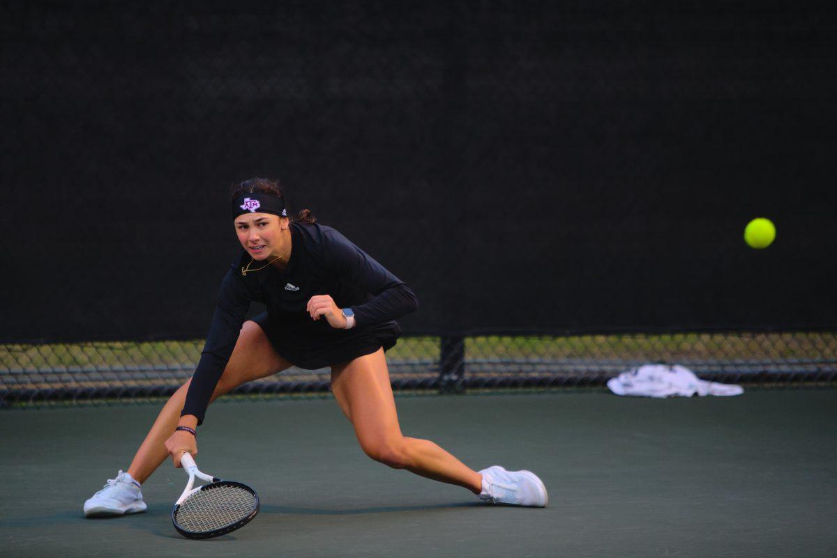 Freshman Mia Kupres returning a difficult volley&#160;at Mitchell Outdoor Tennis Center on Friday, Jan. 20, 2023.