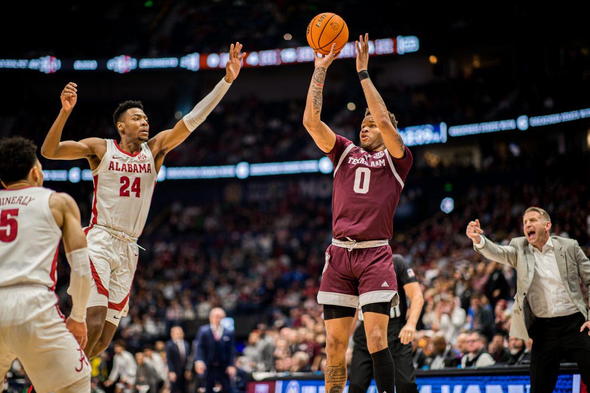 Graduate G Dexter Dennis (0) shoots a three pointer during a game vs. Alabama on March 12, 2023 at Bridgestone Arena in Nashville Tennessee.