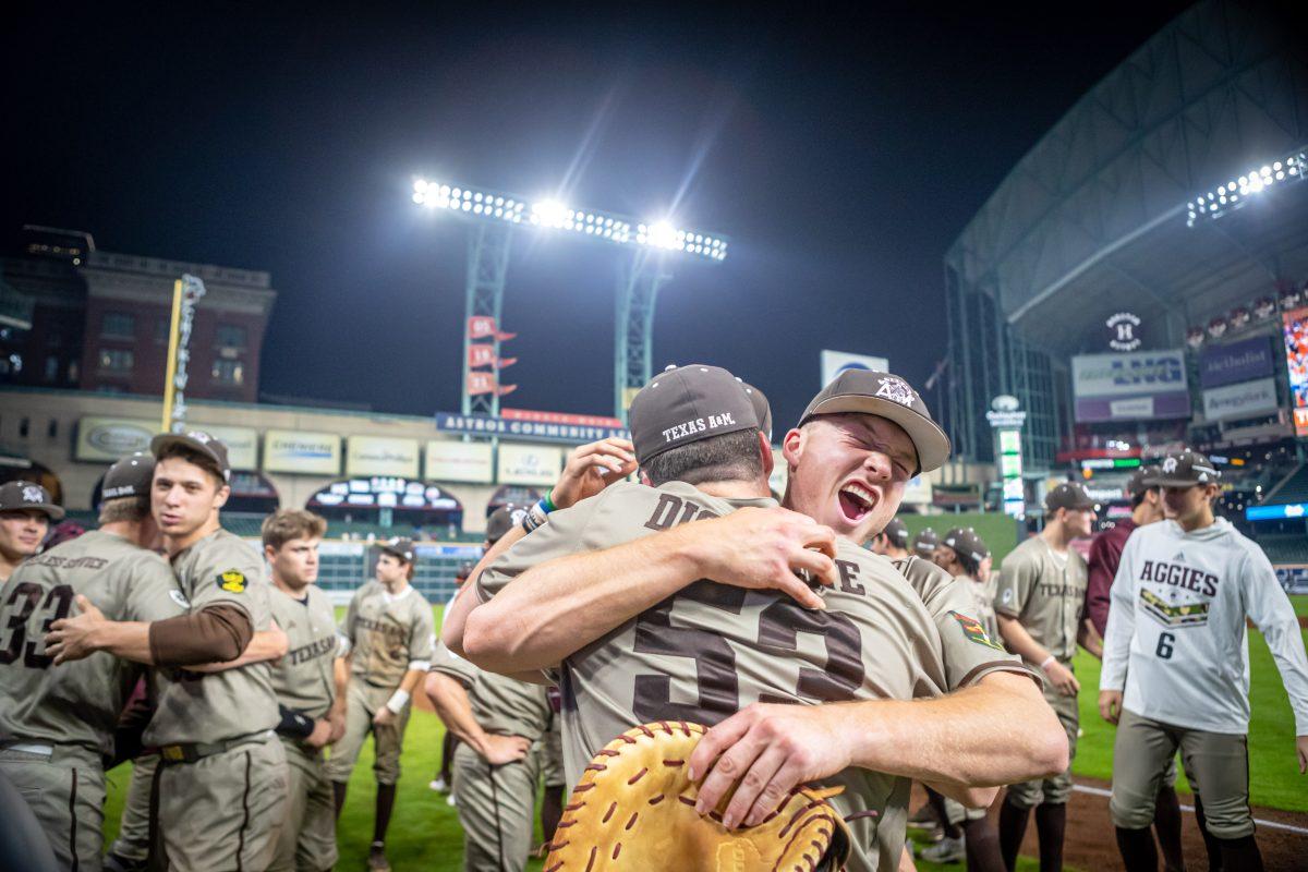 Junior 1B Jack Moss (9) hugs junior LHP Evan Aschenbeck (53) after Texas A&M defeated Texas Tech 4-2 in 16 innings at Minute Maid Park in Houston, Texas, on Monday, March 6, 2023.