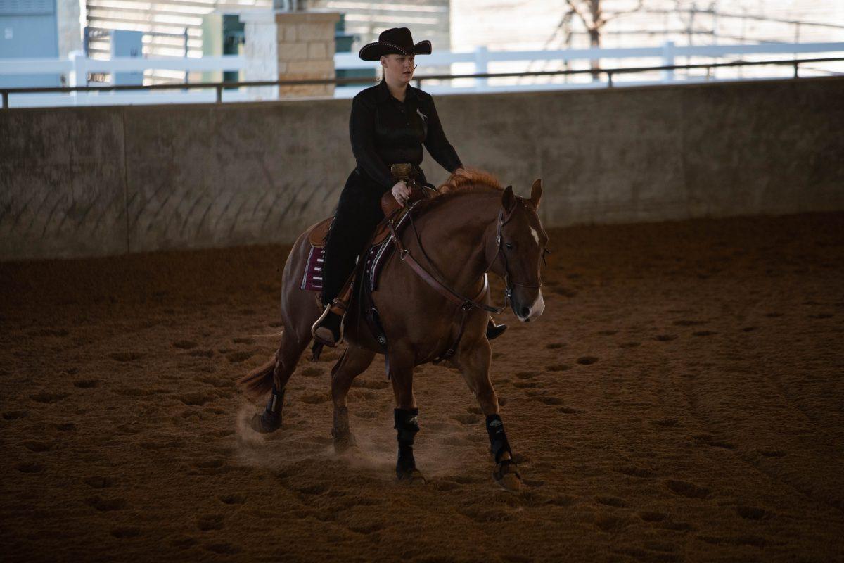 <p>Senior Emmy-Lu Marsh rides A&M's Tank in the reining event during the competition against Auburn at Hildebrand Equine Complex on Saturday, Feb. 4, 2023.</p>