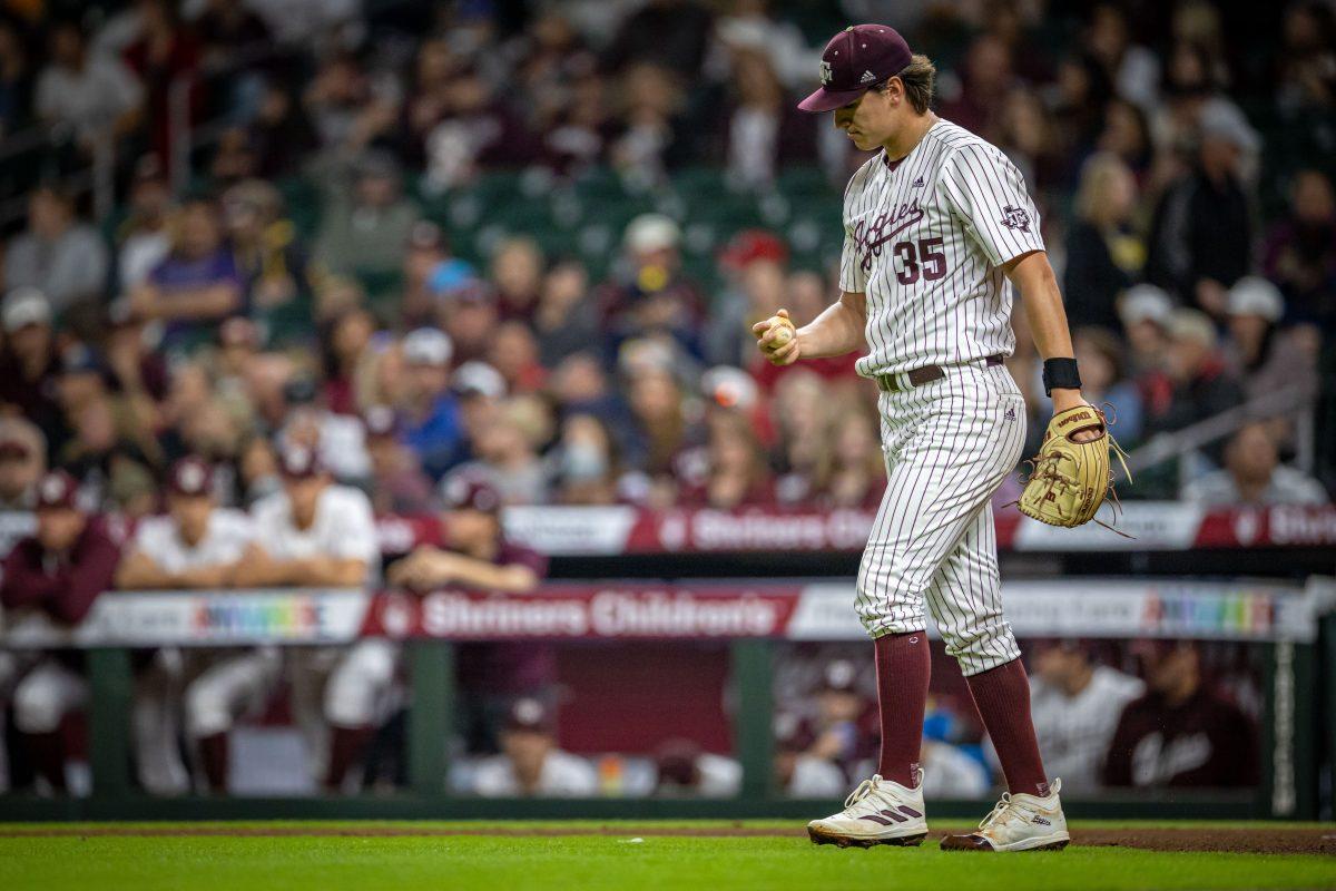 Junior RHP Nathan Dettmer (35) returns to the mound after a wild pitch allowed a runner to score during Texas A&Ms game against Louisville at Minute Maid Park in Houston, Texas, on Friday, March 3, 2023.